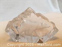 Front view of etched 3D glass paperweight with polar bear in relief, showing original Mats Jonasson label and signature.