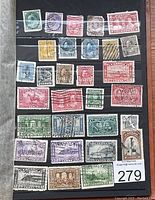 Two pages of assorted pre-1953 used Canadian postage stamps, displayed in an album with cancellation marks visible on most stamps.