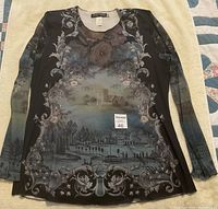 Front view of the women's Michal Negrin designer top showing the scenic floral print and long sleeves