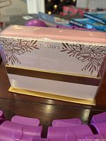 Packaged pink and gold thank you cards with floral design and the word 'THANKS'