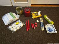 Overview photo showing all candles, candle holders, tray, and matches arranged on the floor.