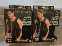 Front view of two SaunaFX men's neoprene sauna vest packages, showing model and product branding on the front.
