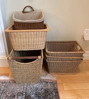 Six assorted baskets stacked and arranged, showing various sizes and textures.