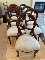 Front view of all seven chairs arranged in two rows