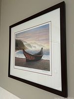 Angled view of entire framed print hanging on wall.