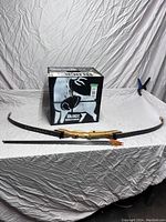 Full view including wooden recurve bow missing string, three arrows, and block target box with 'Block Crossbow' branding.