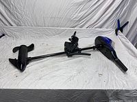 Full view of electric trolling motor showing propeller, shaft, and motor head on white backdrop.