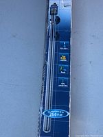 Front side view of TrolTemp aquarium heater box showing temperature range, application types (marine, fresh), and gallon capacity (264 US gal)