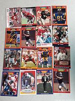 Photo showing 15 NFL Pro Set football cards arranged in a grid, featuring players in full uniform with teams like Falcons, Rams, Bills, Redskins