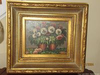 Full view of the framed oil on canvas still life painting depicting colorful pansy flowers in pots.