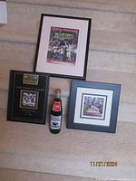 Framed Sports Illustrated cover, 'That Perfect Season' book, framed Nittany Lion photo, and unopened Coke bottle displayed on stair steps