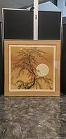 Framed square picture approximately 25X25 inches featuring tree branches and full moon artwork.
