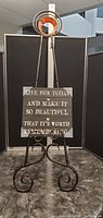 Full view of the floor picture easel holding the inspirational wall art sign, showing overall size and styling