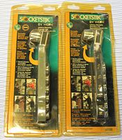 Two Socketstik portable ratchet wrench tool sets in original sealed plastic packaging. Each set includes sockets stored within the handle, one set SAE sockets, the other Metric.