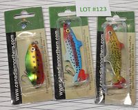 Front view of all three packaged fish lures showing their vibrant colors and hooks.
