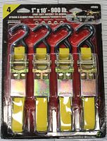 Photo of full packaging showing four yellow 1" x 10' ratchet tie down straps with red hooks and metal ratchet mechanisms.