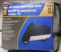 Box front showing brand, product name, image of motorcycle cover, and key features including waterproof, scratch resistant 3000D nylon panel, elastic bottom, and ventilation.