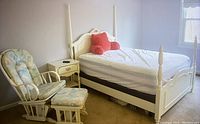 Full canopy bed, nightstand, rocking chair and ottoman