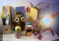 Photo showing the entire set of bedroom decoration items including stationery box, owl plush, nesting dolls, ceramic mirror, dreamcatcher, and pink desk lamp.