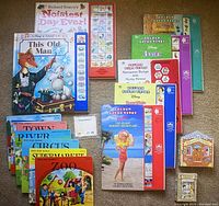 Full view of the diverse collection of children's books showing various titles and categories arranged on floor