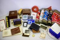 Overall lot including decorative cloths, wallets, electronic gadgets, watches, and wooden boxes.
