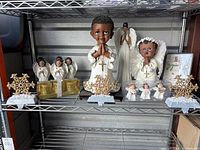 Shelf display of all items including angel figurines, stocking holders, and Hallmark cards