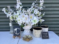 Overall view of the lot with all items displayed on a white surface against a dark background.