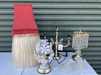 Photo showing all three lamps together with their shades, noting the damage to the top tier lamp and fabric tassel shade.