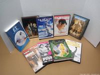 All nine DVD cases displayed upright and flat