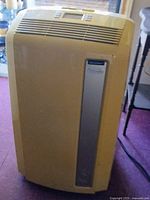 Front view showing controls, vent, and silver accent