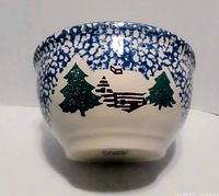 Side view showing cabin and tree design plus blue sponge pattern