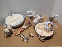 Overall view of all fairy-tale dinnerware, figurines and utensils