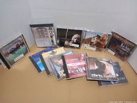 Group of twelve music DVDs arranged in two rows