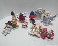 Full view of ten Christmas figurines and ornaments