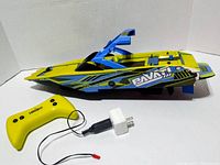 Pavati RC boat, controller, charger visible together