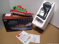 Entire set with boat, controller in foam, manuals and box