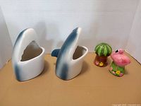 Front view showing two shark head mugs and two shakers
