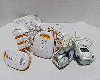 Four VTech baby monitor units, power adapters, and manual
