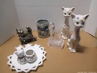 Front view of all cat collectibles