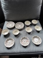 Top view of coffee cups, saucers, and dessert nappies showing pattern and condition