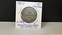 Front side of the 1907 Newfoundland 50 Cents silver coin showing the denomination and year.