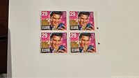 Block of four 1993 Elvis Presley 29 cent US stamps on white background, showing full design and mint condition.