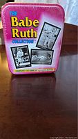 Front of tin with 'The Babe Ruth Collection' and images of Babe Ruth in black and white, sealed in shrink wrap