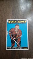 Front view of 1965 Topps Pat Stapleton hockey card showing player in Chicago Black Hawks uniform.