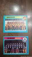 Front view of two hockey cards from 1979 OPC set: Vancouver Canucks and Colorado Rockies team photos.
