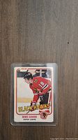 Front of Denis Savard rookie card showing player in Blackhawks uniform and card branding.