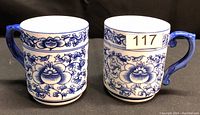 Two Bombay brand porcelain tea cups with blue floral designs, front view
