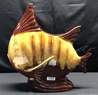 Full side view of the Blue Mountain Pottery sunfish sculpture showing its shape and color pattern.