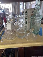 Full display of various glass canisters with bar butler, showing different styles and heights.