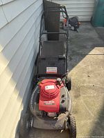 Top view showing red Honda HRC216 engine cover and front wheels.